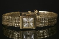 Lot 621 - A ladies' 9ct gold trident mechanical bracelet watch