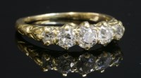 Lot 93 - A late Victorian five stone carved head ring