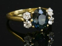 Lot 260 - A green sapphire and diamond ring