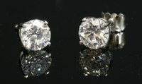 Lot 470 - A pair of 18ct white gold single stone diamond earrings