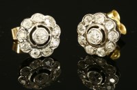 Lot 193 - A pair of Edwardian diamond set daisy cluster earrings