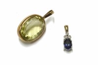 Lot 3 - A 9ct gold oval mixed cut citrine pendant