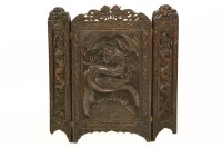 Lot 401 - An early 20th century carved hardwood three fold screen
