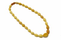 Lot 63 - A single row graduated lozenge shaped amber bead necklace
44.28g