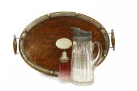 Lot 186 - A stained oak twin-handled presentation tray with silver plated gallery
