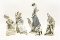 Lot 255 - A collection of four Lladro figures