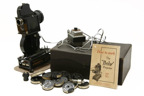Lot 251 - A French Pathe-Baby hand-cranked film projector in original case
