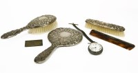 Lot 112 - A silver backed four piece dressing set