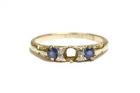 Lot 51 - An 18ct gold sapphire and diamond boat shaped ring