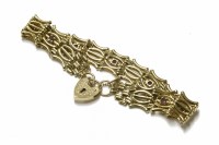 Lot 76 - A 9ct gold five row gate link bracelet with padlock