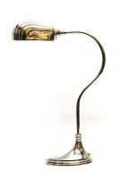 Lot 275 - A nickel plated desk lamp with shell shape shade