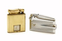 Lot 93 - A Colibri 'Monopol' gold plated lighter with an inset watch movement