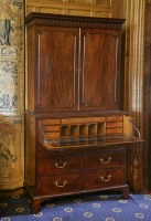 Lot 452 - A George III mahogany secretaire cabinet