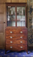 Lot 454 - A George III mahogany and boxwood strung secretaire bookcase