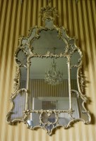 Lot 438 - A George II giltwood wall mirror