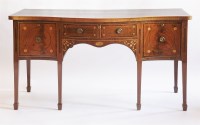 Lot 477 - A George III mahogany serpentine front sideboard