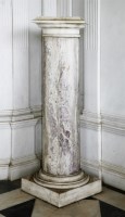 Lot 546 - A mottled grey/pink marble column