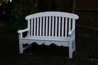 Lot 560 - Two white painted wooden garden seats