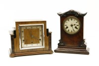 Lot 262 - An Art Deco mantle clock with pendulum and key