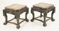 Lot 1326 - A pair of Chinese hardwood vase stands