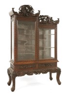 Lot 1329 - A Chinese hardwood display cabinet