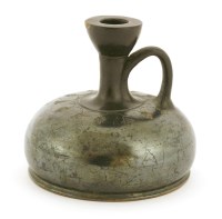 Lot 289 - A Roman squat blackware terracotta bottle