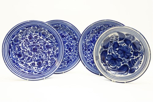 Lot 232 - A set of three 19th century tin glazed blue and white chargers