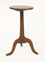 Lot 570 - A yew candle stand