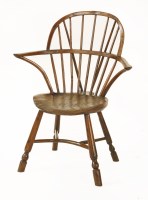 Lot 567 - A West Country yew wood double-bow back Windsor armchair