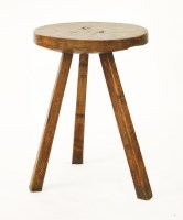 Lot 568 - A primitive Welsh antique elm cricket table