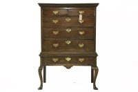 Lot 444 - An 18th century oak chest on stand