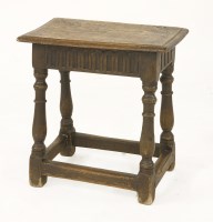 Lot 575 - An oak joint stool