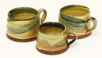 Lot 195 - Three glazed pottery mugs