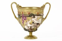 Lot 135 - A Capodimonte gilt end painted twin handled cup