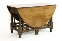 Lot 586 - An 18th century oak gateleg table