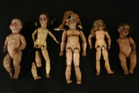 Lot 297 - Five bisque head dolls