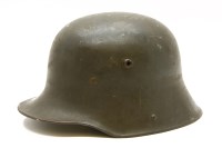 Lot 215 - A German tin helmet