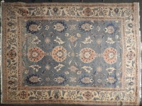 Lot 611 - A Persian design blue ground carpet