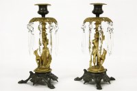 Lot 164 - A pair of ormolu and bronze candle sticks