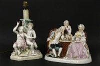 Lot 424 - A late 19th century early 20th century porcelain figural group in the form of a gentleman and his two ladies playing chess