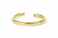 Lot 29 - A 22ct gold wedding ring (cut open through shank)
3.01g