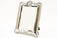 Lot 129 - An Edwardian silver easel mirror