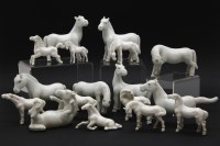 Lot 110 - A quantity of white glazed pottery horses and foals