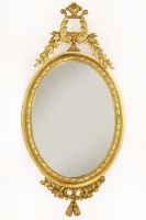 Lot 575 - A modern oval gilt lyre mirror