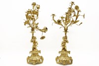 Lot 296 - A pair of 19th century ormolu candelabra supported by cherubs