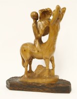 Lot 475 - A carved wood centaur