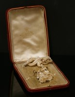 Lot 1 - A seed pearl matched brooch and earrings suite
