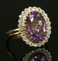 Lot 360 - An amethyst and diamond oval cluster ring