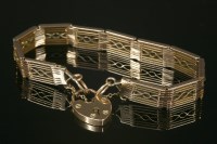 Lot 675 - An Edwardian gold seven row gate-link bracelet