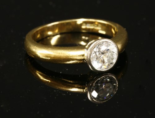 Lot 435 - An 18ct two colour gold single stone diamond ring